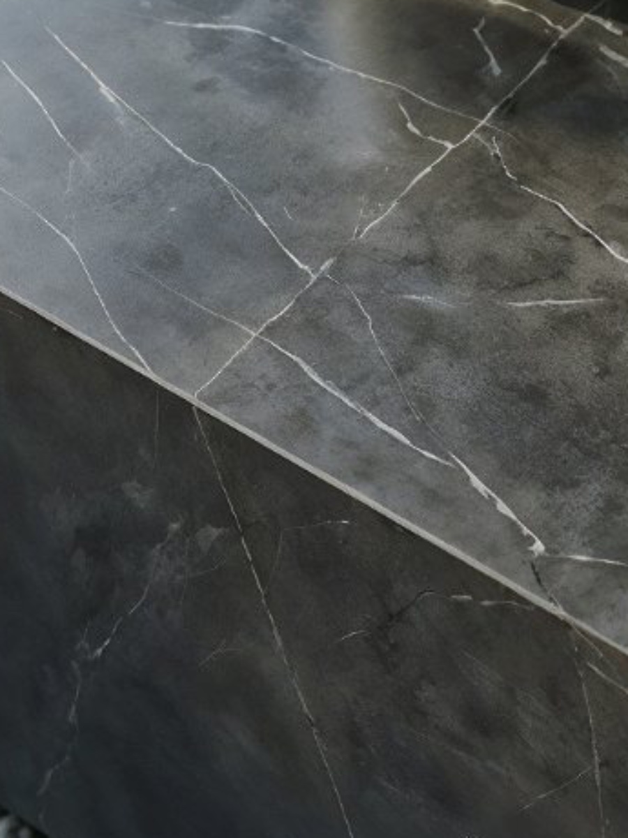 Nero Marquina marble surface — near-black struck through with white