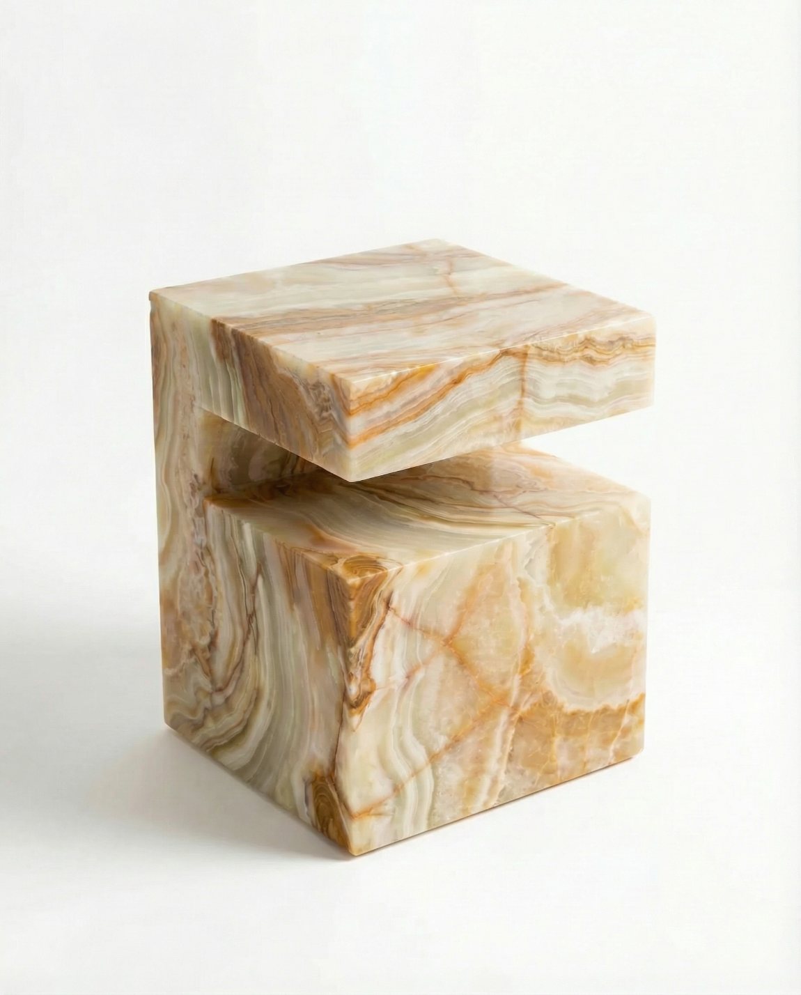 Onyx Shift honey onyx side table beside a leather chair