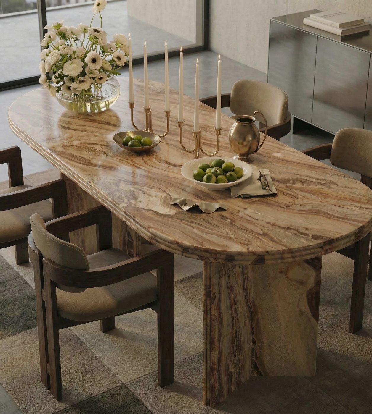 Rosso Orobica oval marble dining table in a sunlit room